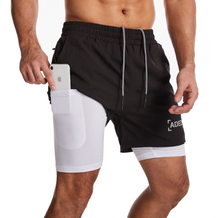"Andningsbara dubbellager sportshorts för herrar med elastisk passform, praktiska fickor och inbyggda komprimerande tights."