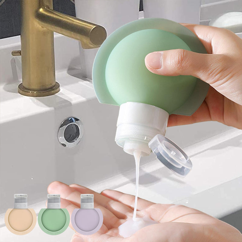 "Bärbar silikonflaska för resor med stor öppning, lätt att fylla. Perfekt accessoar för schampo och lotion på resan."