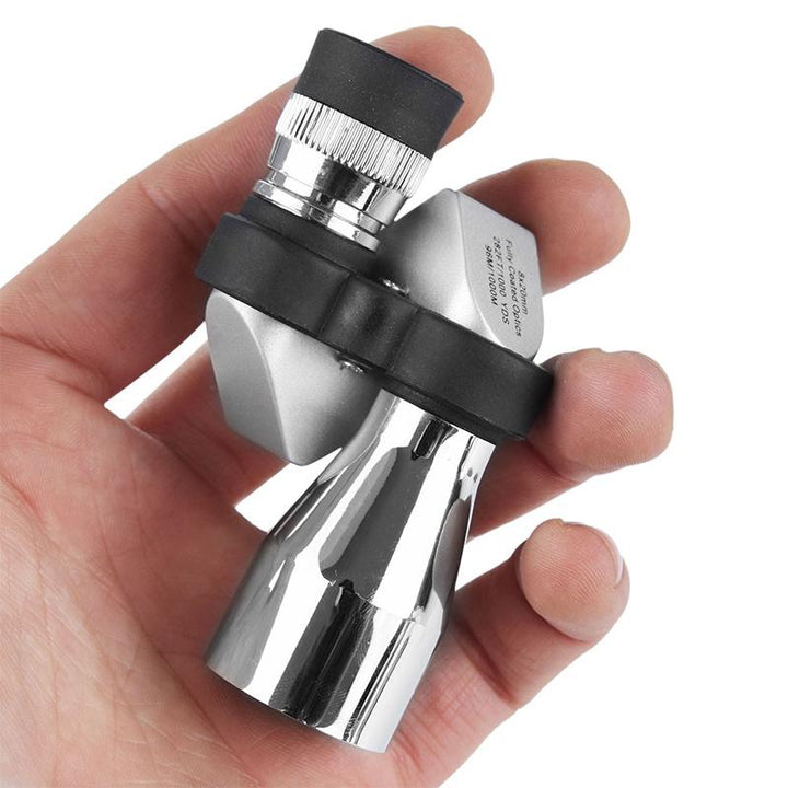 "Bärbart fickteleskop med BAK4 prisma, svart och kompakt design, perfekt för natur- och stjärnskådning utomhus."