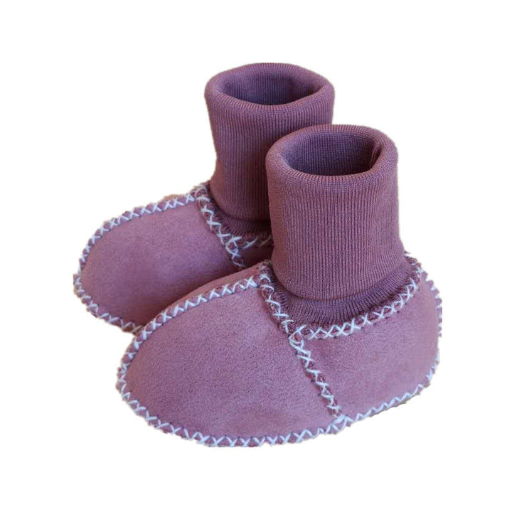 "Bebis vinterstrumpor med anti-slip, fodrade i bomullsull, hög rör design, elastisk passform i ljusa färger."