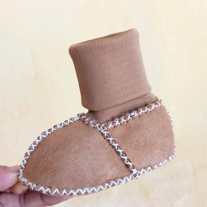 "Bebis vinterstrumpor med anti-slip, fodrade i bomullsull, hög rör design, elastisk passform i ljusa färger."