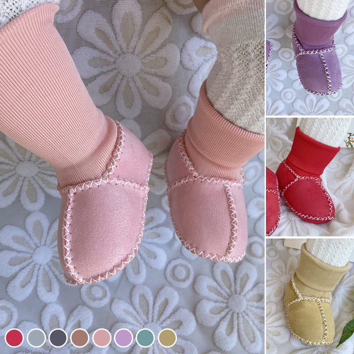 "Bebis vinterstrumpor med anti-slip, fodrade i bomullsull, hög rör design, elastisk passform i ljusa färger."