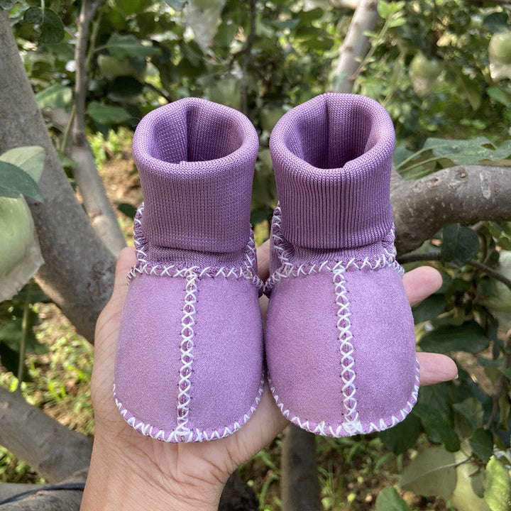"Bebis vinterstrumpor med anti-slip, fodrade i bomullsull, hög rör design, elastisk passform i ljusa färger."
