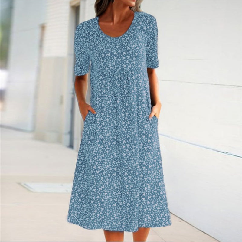 "Blommig dam midi klänning, rund hals, kort ärm, vår/sommar, feminin design, bekväm passform."
