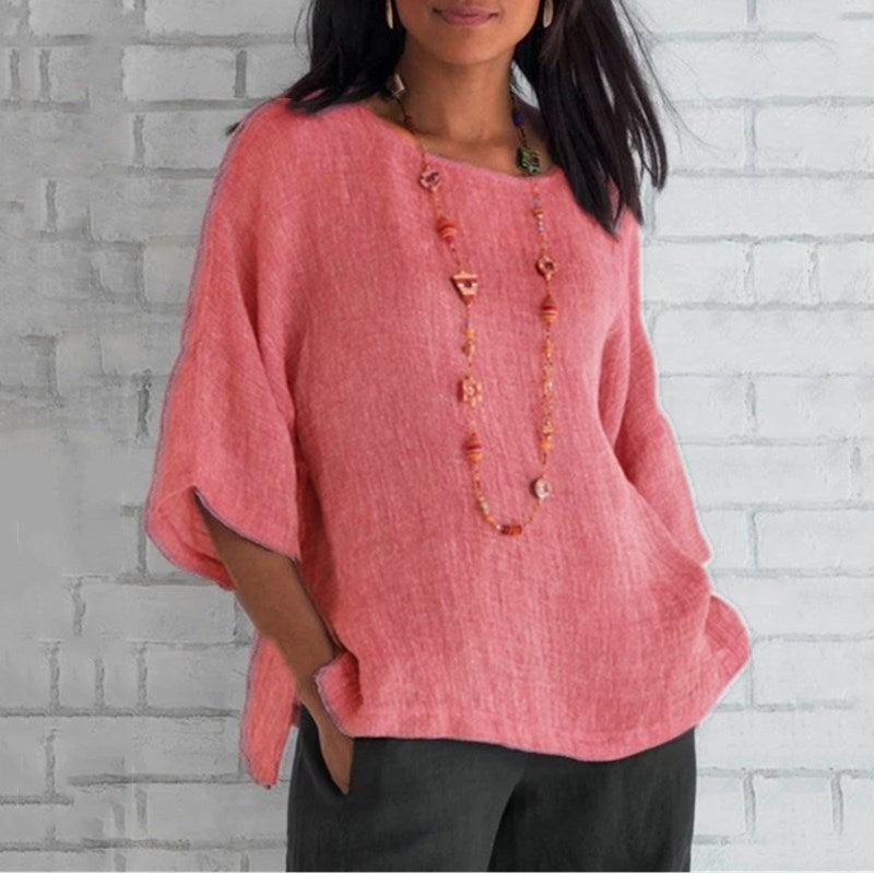 "Dam enfärgad blus med rund hals och trekvartsärm, stilren design och mjukt material för elegant och bekväm look."