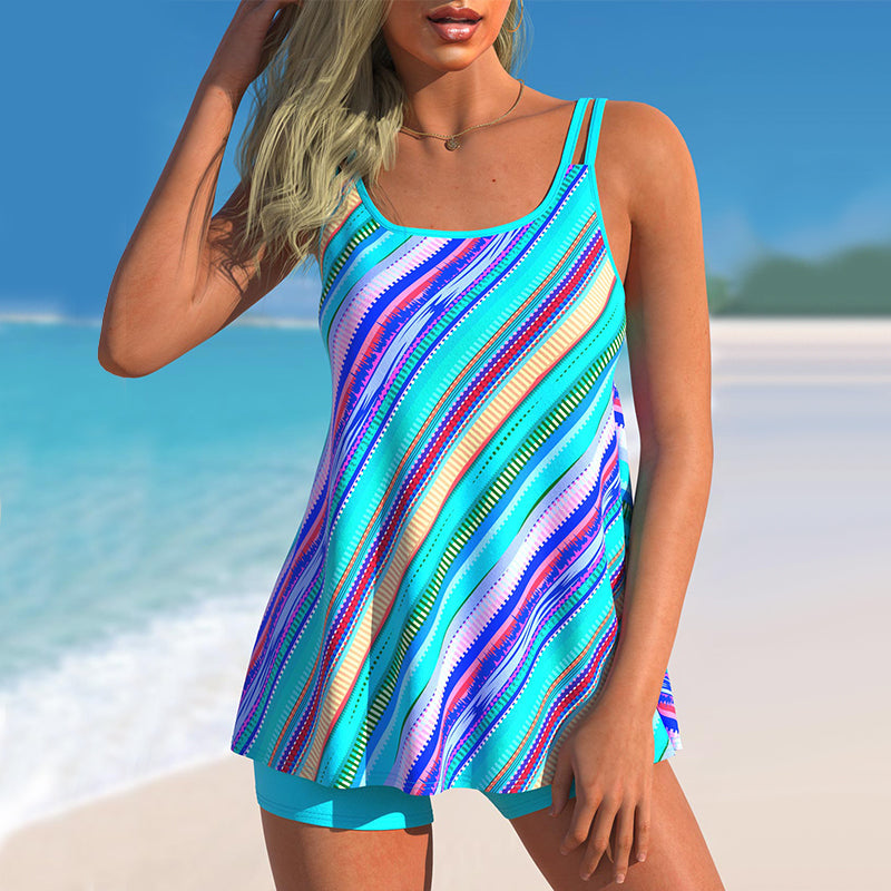 "Dam geometriska randiga tankini, framifrån. Vadderad topp, livfulla randtryck, spandex och polyester för smidig passform."
