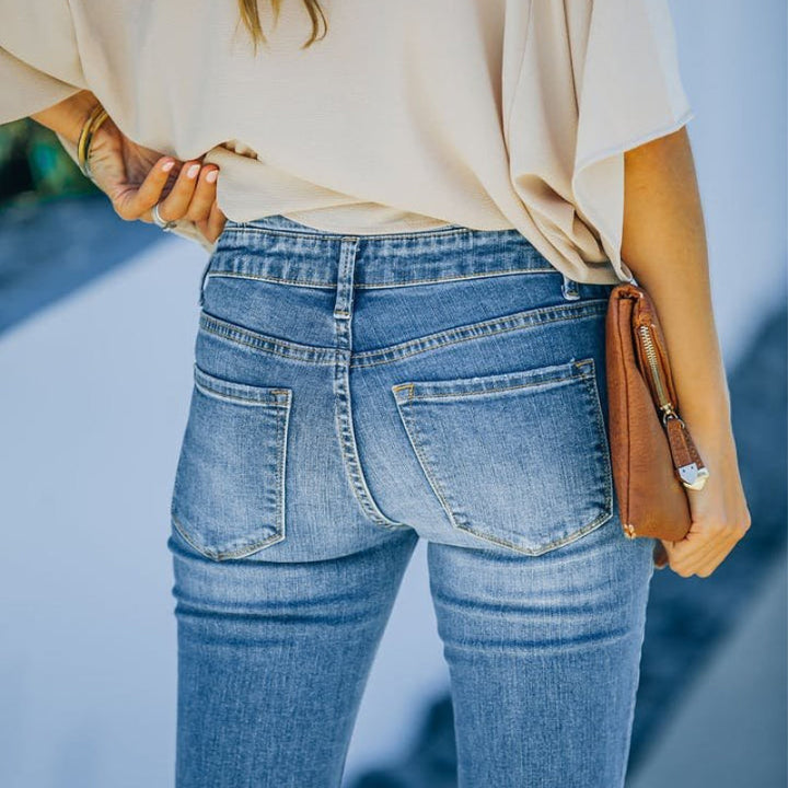 "Dam högmidjade 70-tals flare jeans, vintage stil, blå denim med smickrande passform och böjda midjesömmar."