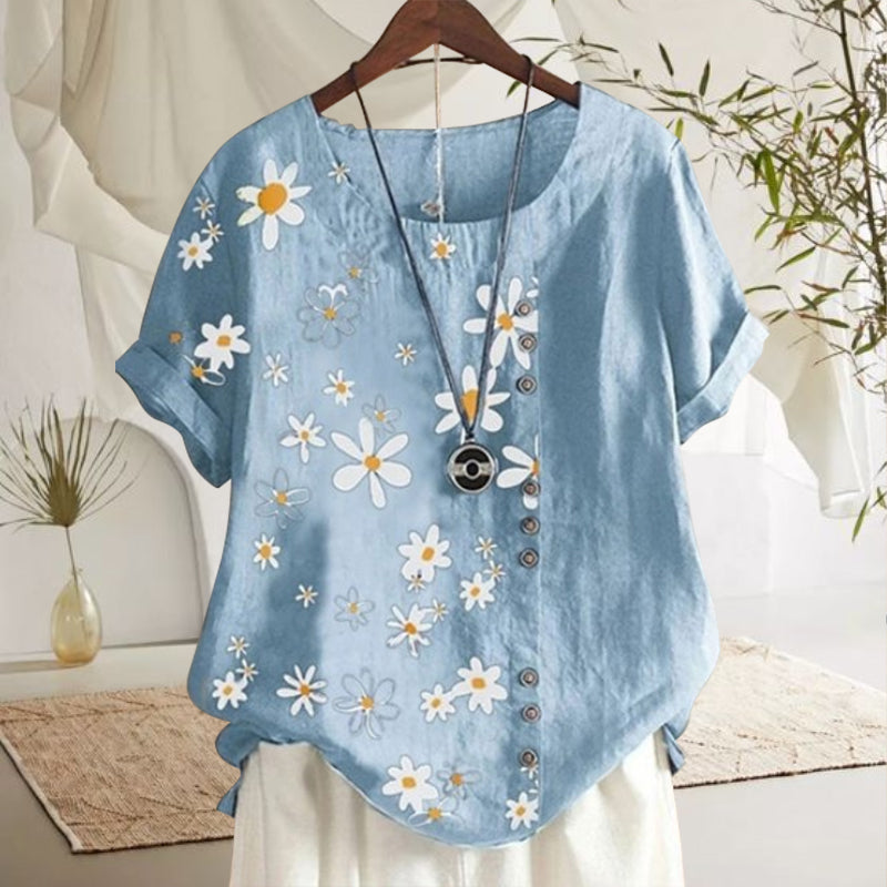 "Damblus med prästkrage och blommönster, rund hals, korta ärmar i mjuk bomull, elegant och avslappnad stil."