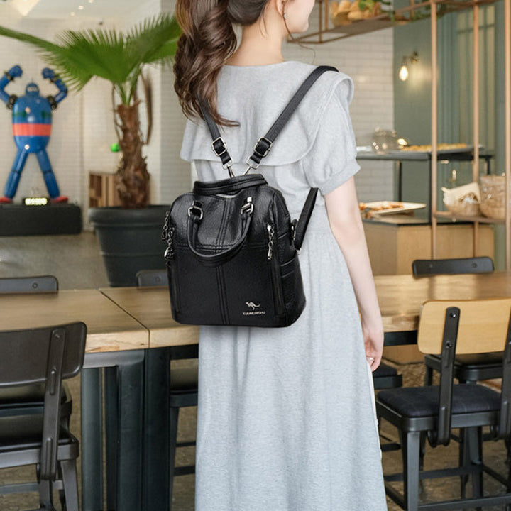 "Damer PU-läder multifunktionell ryggsäck i röd, elegant och slitstark design för vardag och resor, stor kapacitet."