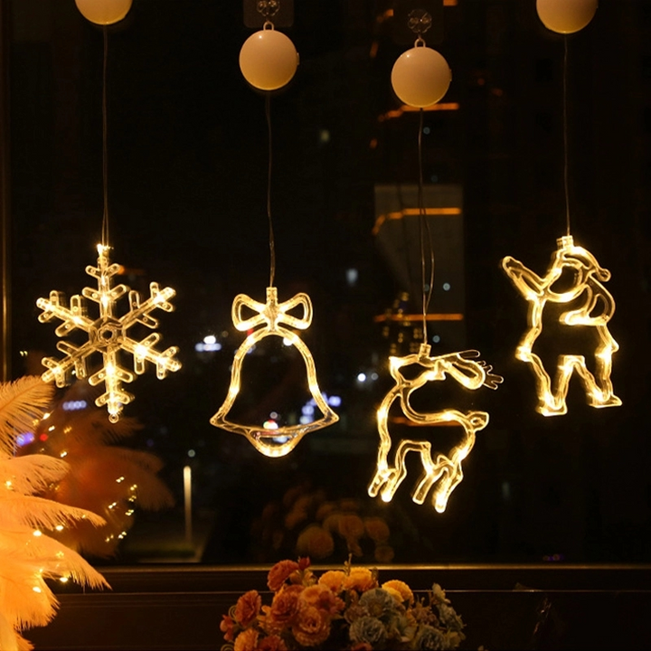 "Dekorativa LED-lampor med sugkopp, julmotiv: tomte, snöflinga, varmvit ljus för inbjudande julstämning i hemmet."