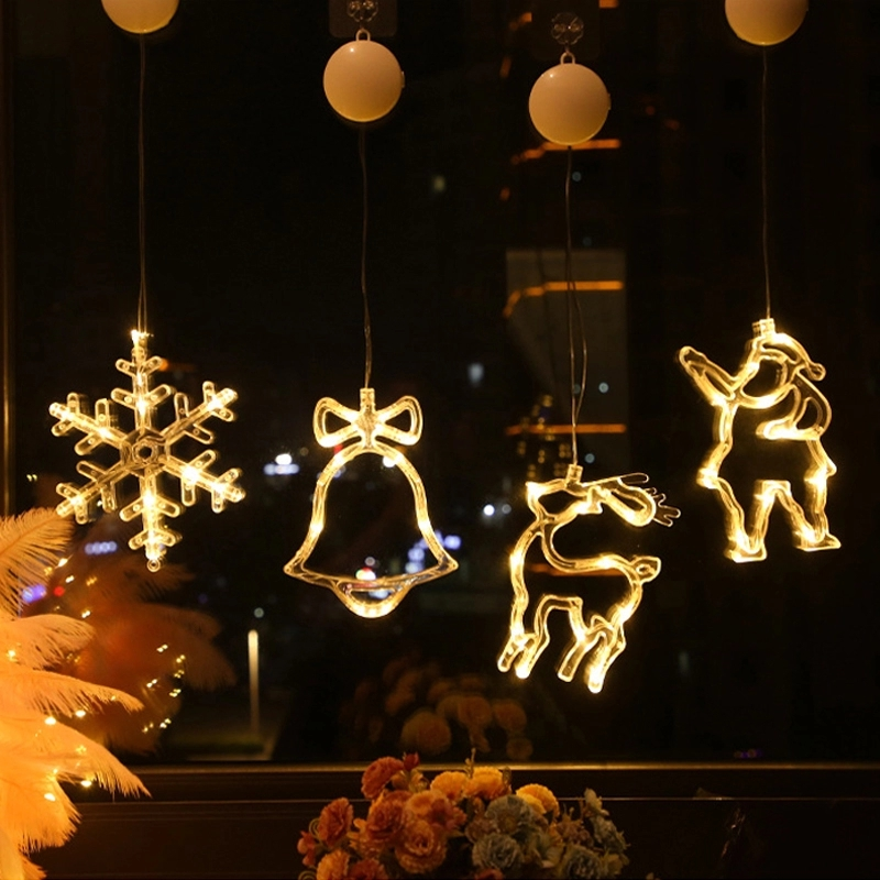 "Dekorativa LED-lampor med sugkopp, julmotiv: tomte, snöflinga, varmvit ljus för inbjudande julstämning i hemmet."