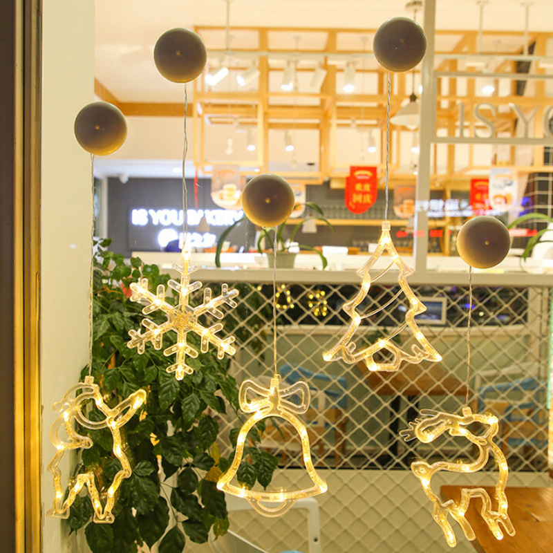 "Dekorativa LED-lampor med sugkopp, julmotiv: tomte, snöflinga, varmvit ljus för inbjudande julstämning i hemmet."