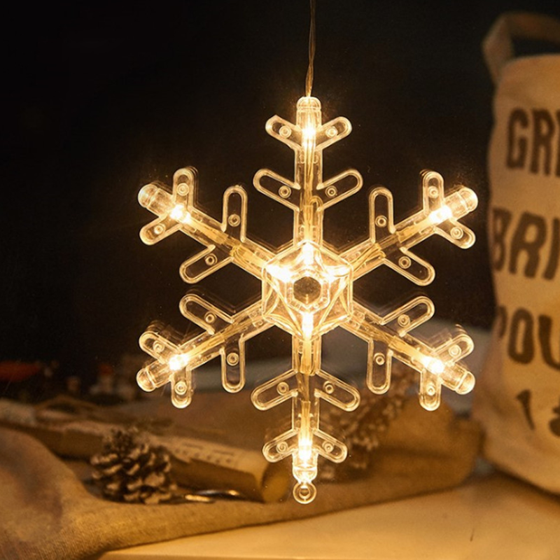 "Dekorativa LED-lampor med sugkopp, julmotiv: tomte, snöflinga, varmvit ljus för inbjudande julstämning i hemmet."