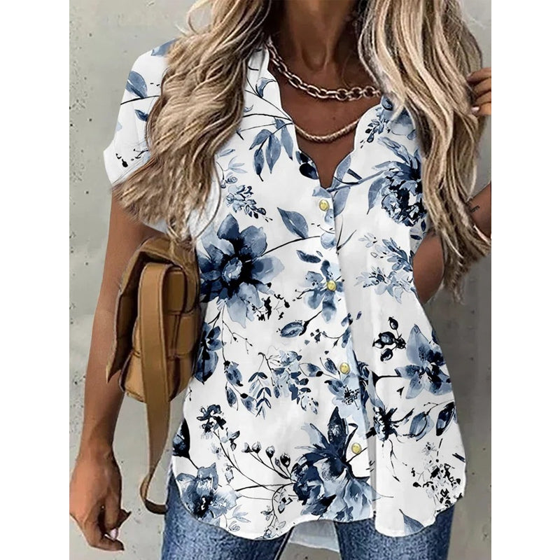 "Elegant dam V-ringad kortärmad blus med blommigt mönster för en feminin och stilfull look."