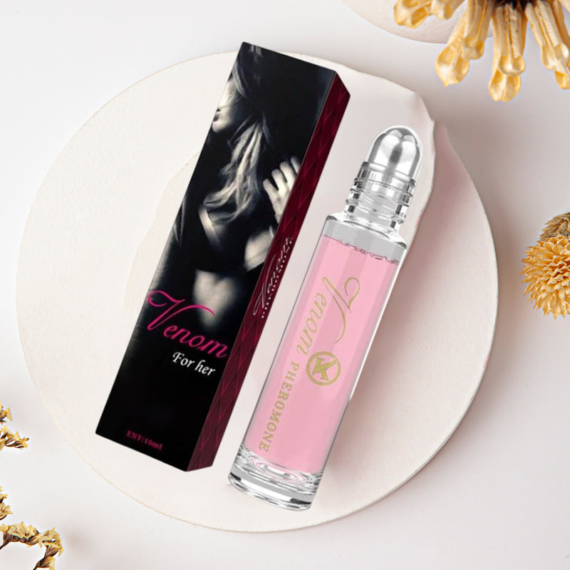 "Elegant flaska med rosa/guld toner, 10ml feromonparfym för män och kvinnor, förstärker naturlig attraktion."
