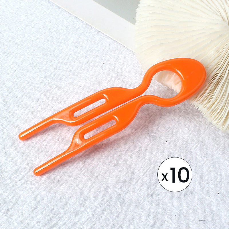 "Elegant fransk hårnål i mångfärgad design för stilfull hårstyling; perfekt damaccessoar för alla tillfällen."