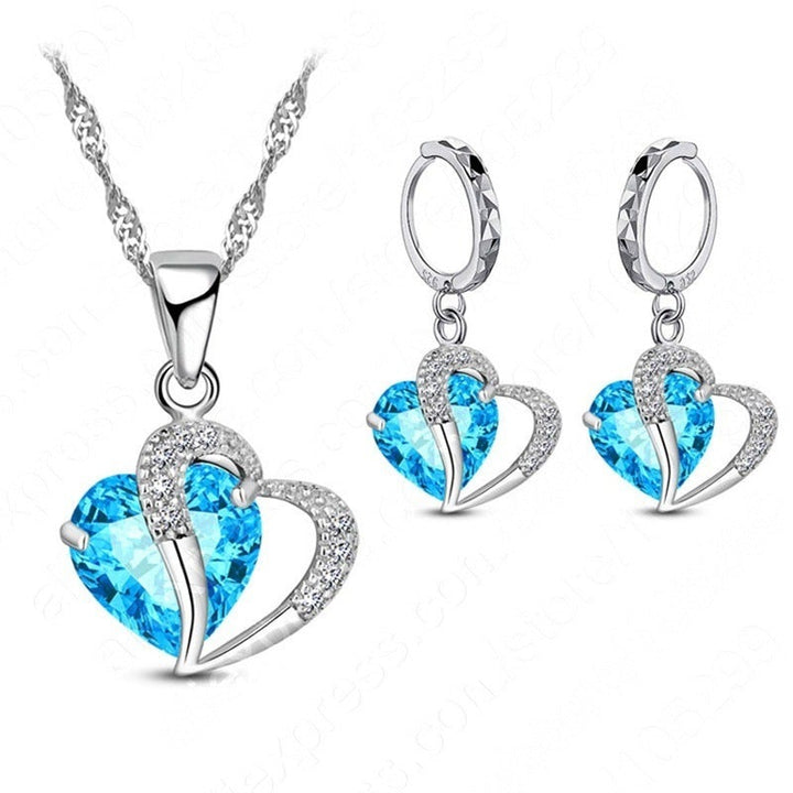 "Elegant hjärtformade zirkonsmycken set för kvinnor med halsband och örhängen i strålande kubiska zirkoner."