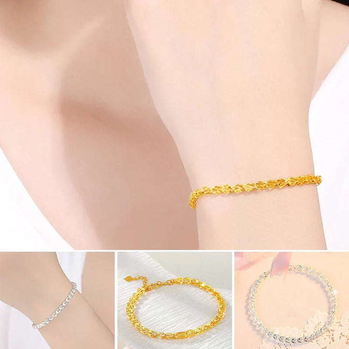 "Elegant justerbart Phoenix armband i guld/silver med unikt fjädermotiv, perfekt kvinnligt smycke för alla tillfällen."