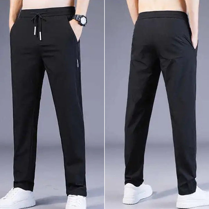 "Eleganta nylonbyxor för män i isig silkeslook, perfekt för sommardagar. Tunn och andningsbar design, med medelhög midja."