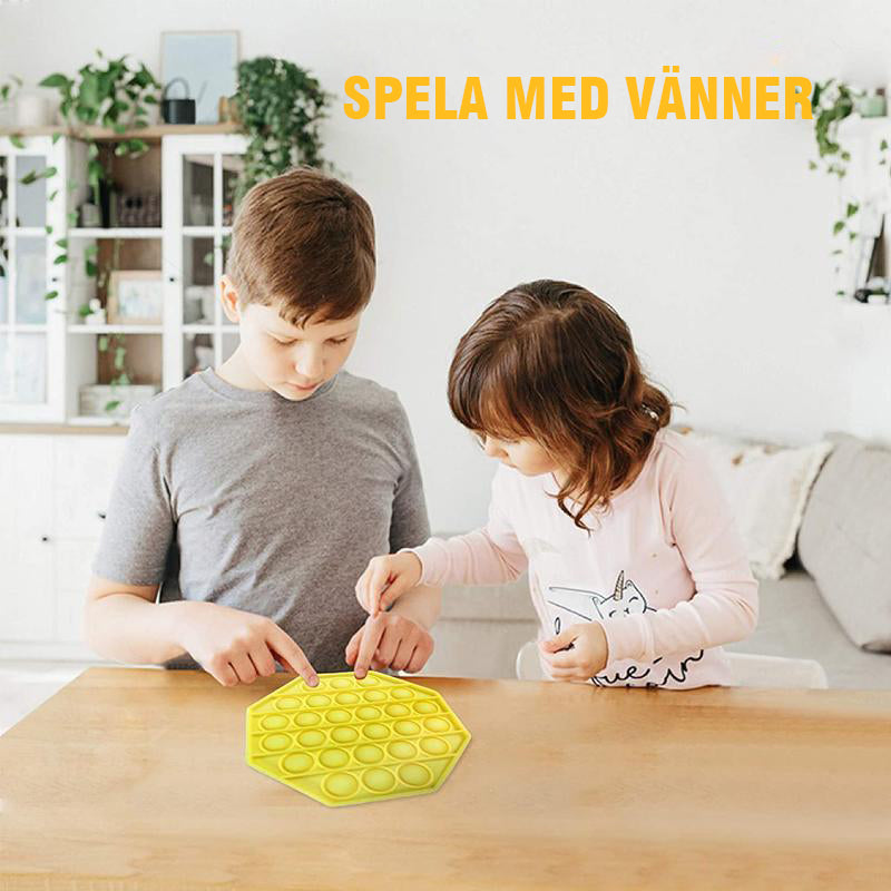 "Färgglad fyrkantig silikon leksak för barn, bubbelpoppande och kreativt stimulerande, utvecklar finmotoriska färdigheter."
