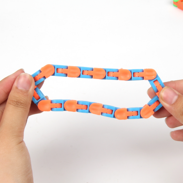 "Färgglad länkspårar snap och klick fidget leksak med 24 vridbara länkar för kreativ stresslindring och lek"