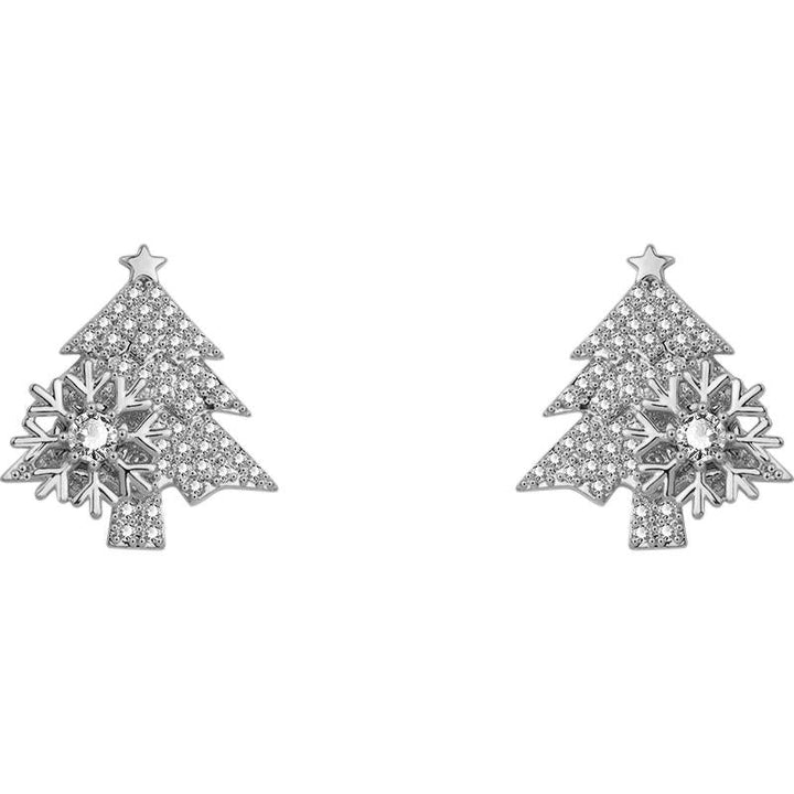 "Festliga julgransformade damörhängen i guld och silver, elegant design och skinande finish för julens högtider."