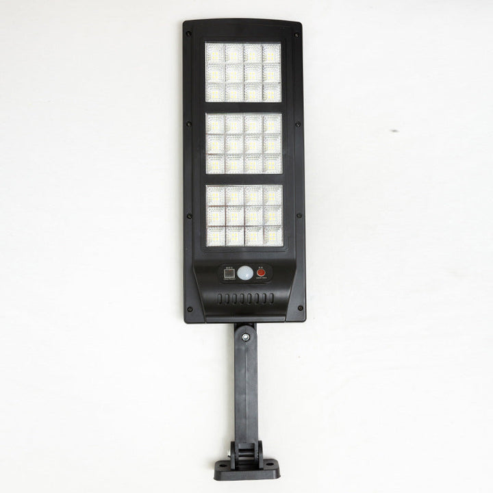 "Fjärrstyrd solcellsdriven gatulampa med 144 LED, rörelsesensor, IP65 vattentät för utomhusbruk, säker och hållbar belysning.