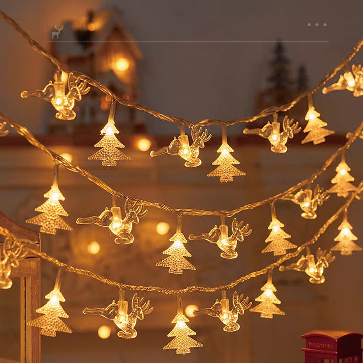 "Förtrollande julsnöre med snöflingor och varm guldljus, perfekt för festlig hemdekor inomhus och skyddad utomhus."