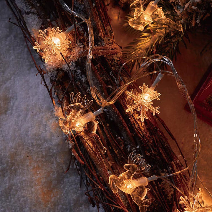 "Förtrollande julsnöre med snöflingor och varm guldljus, perfekt för festlig hemdekor inomhus och skyddad utomhus."
