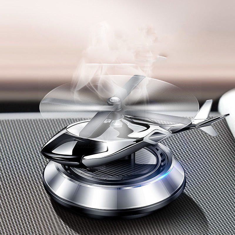 "Futuristisk bil aromaterapi dekoration, solkraft, kompakt design i silver och guld, elegant för bil och hem."