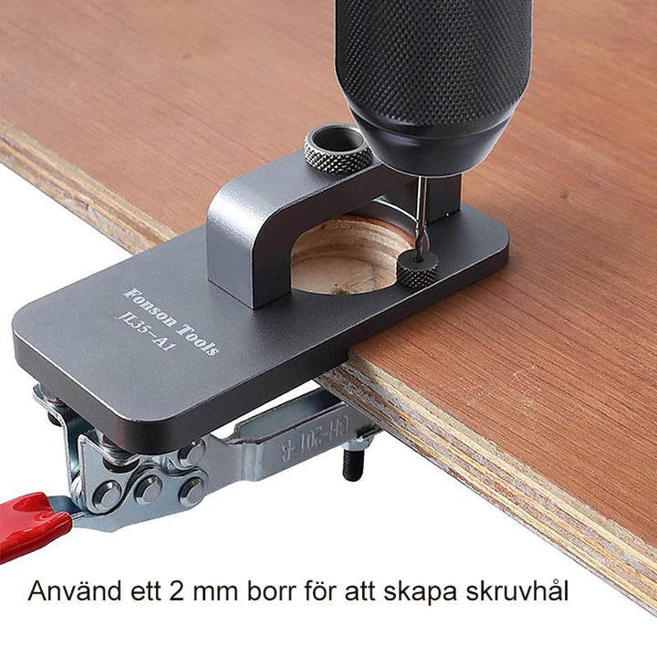Gångjärnsjigg i grå aluminium för dolda gångjärn, justerbar och hållbar, perfekt för möbelproduktion.