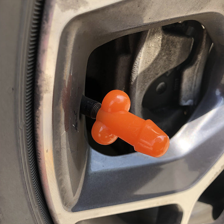 "Glow-in-the-dark ventilstamlock med humoristisk design i olika färger för bilar. Unik och lekfull bilaccessoar."