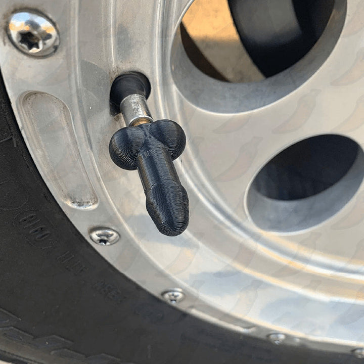 "Glow-in-the-dark ventilstamlock med humoristisk design i olika färger för bilar. Unik och lekfull bilaccessoar."