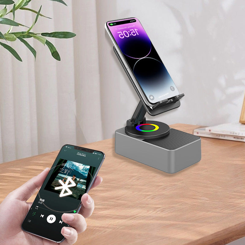 "Grå/svart Bluetooth-ljud powerbank fäste för mobil med 360° rotation och inbyggd subwoofer för dynamiskt ljud."