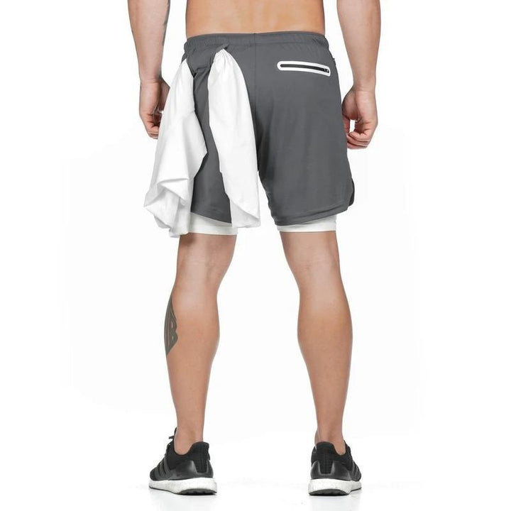 "Herr 2-i-1 shorts med kamouflagemönster och säkerhetsficka, designade för stil och funktionalitet vid träning."