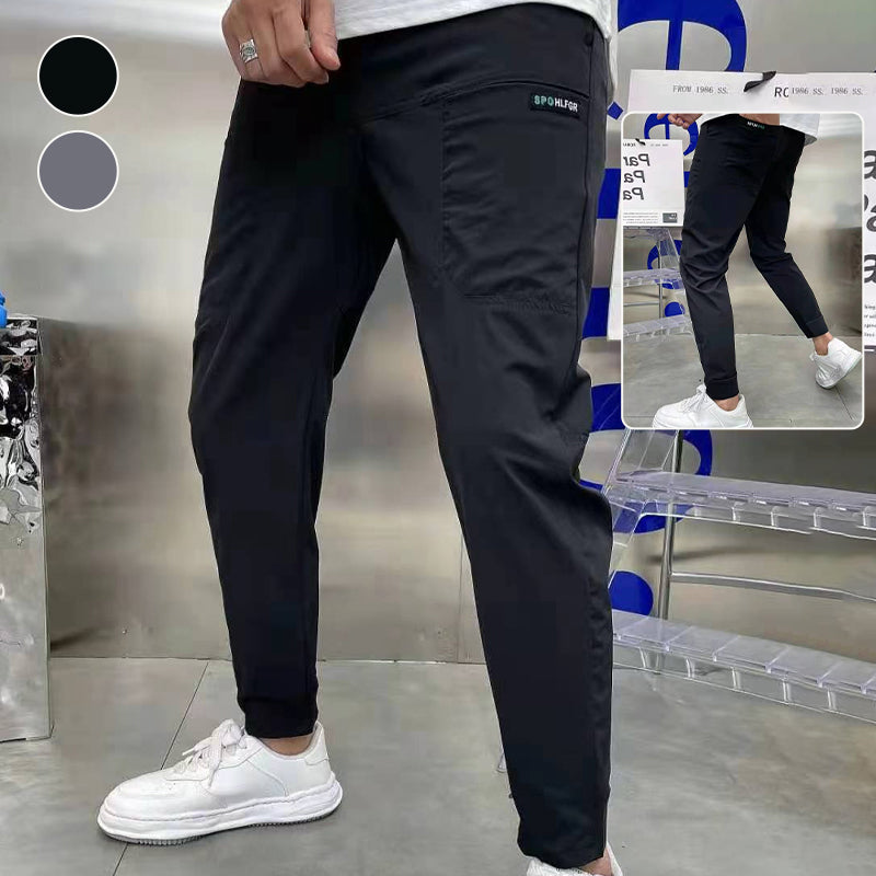 "Herr Cargo-byxor i högstretch, framifrån, gråa med flera fickor, perfekt för urban stil, komfort och vinterbruk."