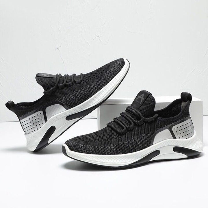 "Herr lättviktsneakers i färgglatt mönster, andningsbart meshtyg och minnesskum-innersula för komfort och stil."