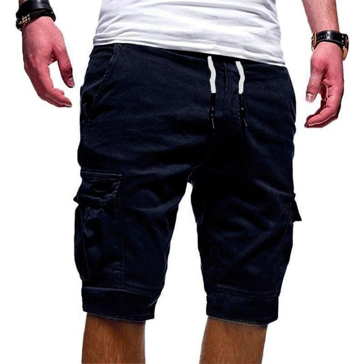 "Herr shorts med multifickdesign i bomull, justerbar snörning i midjan, tillgängliga i flera färger för sommardagar."
