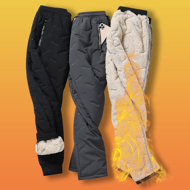 "Herr vinterfleece byxor med resårband, platt benöppning, mörk färg, varm fleece, stilren look för kalla dagar."
