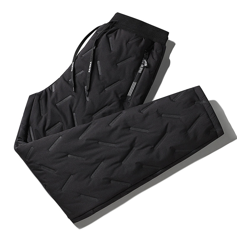 "Herr vinterfleece byxor med resårband, platt benöppning, mörk färg, varm fleece, stilren look för kalla dagar."