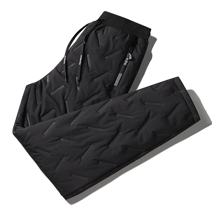 "Herr vinterfleece byxor med resårband, platt benöppning, mörk färg, varm fleece, stilren look för kalla dagar."