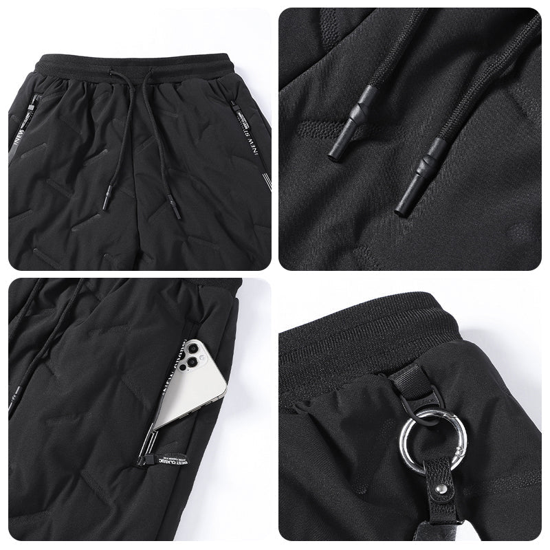 "Herr vinterfleece byxor med resårband, platt benöppning, mörk färg, varm fleece, stilren look för kalla dagar."