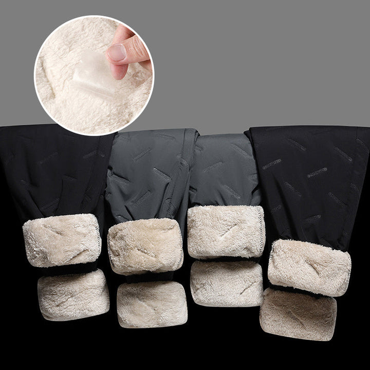 "Herr vinterfleece byxor med resårband, platt benöppning, mörk färg, varm fleece, stilren look för kalla dagar."
