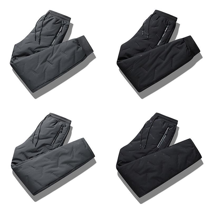 "Herr vinterfleece byxor med resårband, platt benöppning, mörk färg, varm fleece, stilren look för kalla dagar."