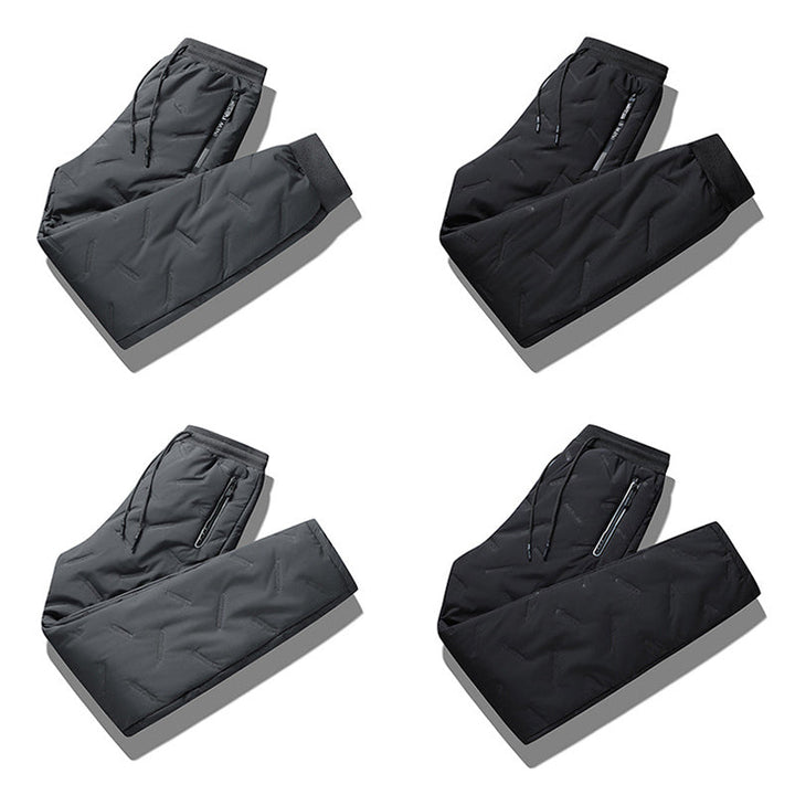 "Herr vinterfleece byxor med resårband, platt benöppning, mörk färg, varm fleece, stilren look för kalla dagar."