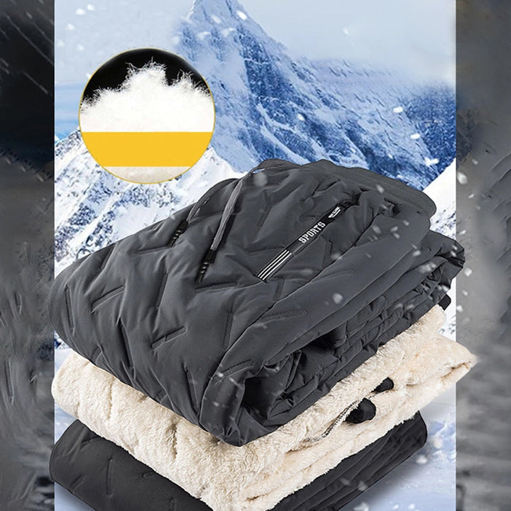 "Herr vinterfleece byxor med resårband, platt benöppning, mörk färg, varm fleece, stilren look för kalla dagar."