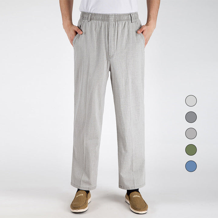 "Herrbyxor i linne, beige, andningsbara med lösa ben och elastisk midja, idealiska för vardagsbruk vår till höst"