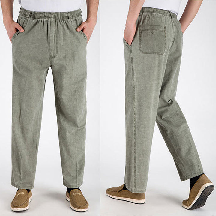 "Herrbyxor i linne, beige, andningsbara med lösa ben och elastisk midja, idealiska för vardagsbruk vår till höst"