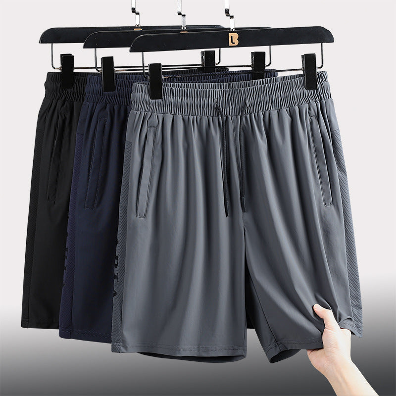"Herrens sommar stretchiga sportshorts i grått, elastisk midja, praktiska fickor, perfekt för träning och fritid."