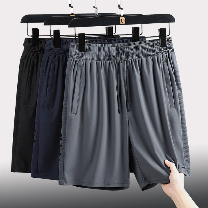 "Herrens sommar stretchiga sportshorts i grått, elastisk midja, praktiska fickor, perfekt för träning och fritid."